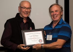 CAPA Director of Competitions Sheldon Boles presents CAPA Vice President Larry Breitkreutz with a Honorary Fellow CAPA Award on behalf of the CAPA Board of Directors